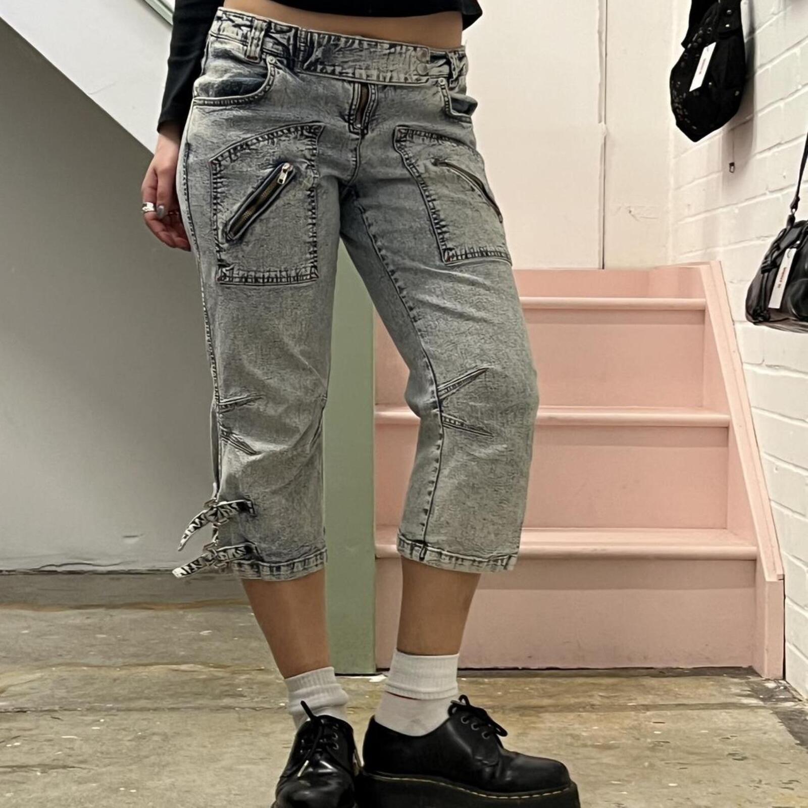 acid wash low rise denim capris with zips and buckles
