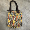 brown and orange Roxy graphic print shoulder bag