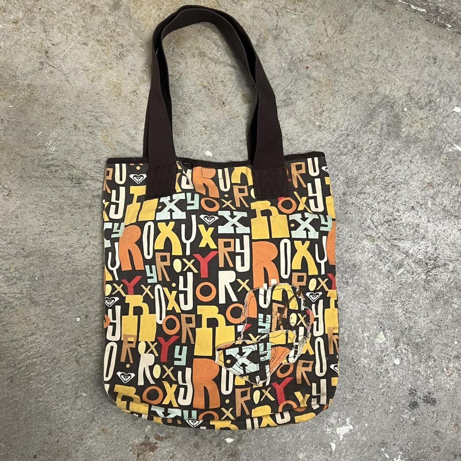 brown and orange Roxy graphic print shoulder bag