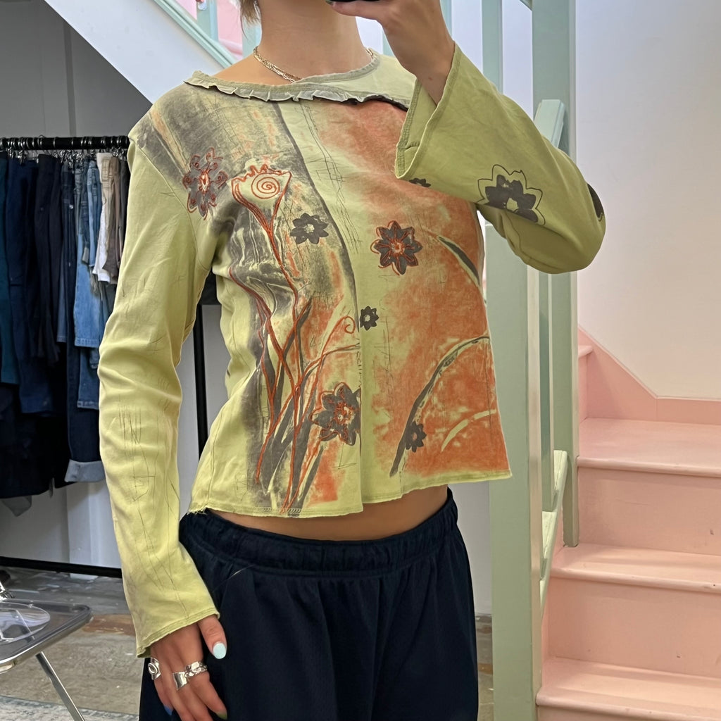 Green and brown blurred floral top