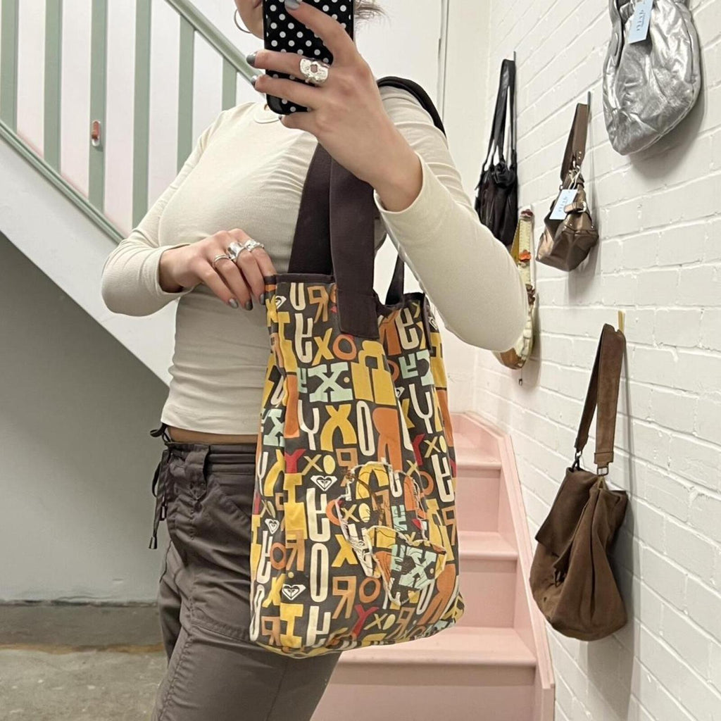 brown and orange Roxy graphic print shoulder bag