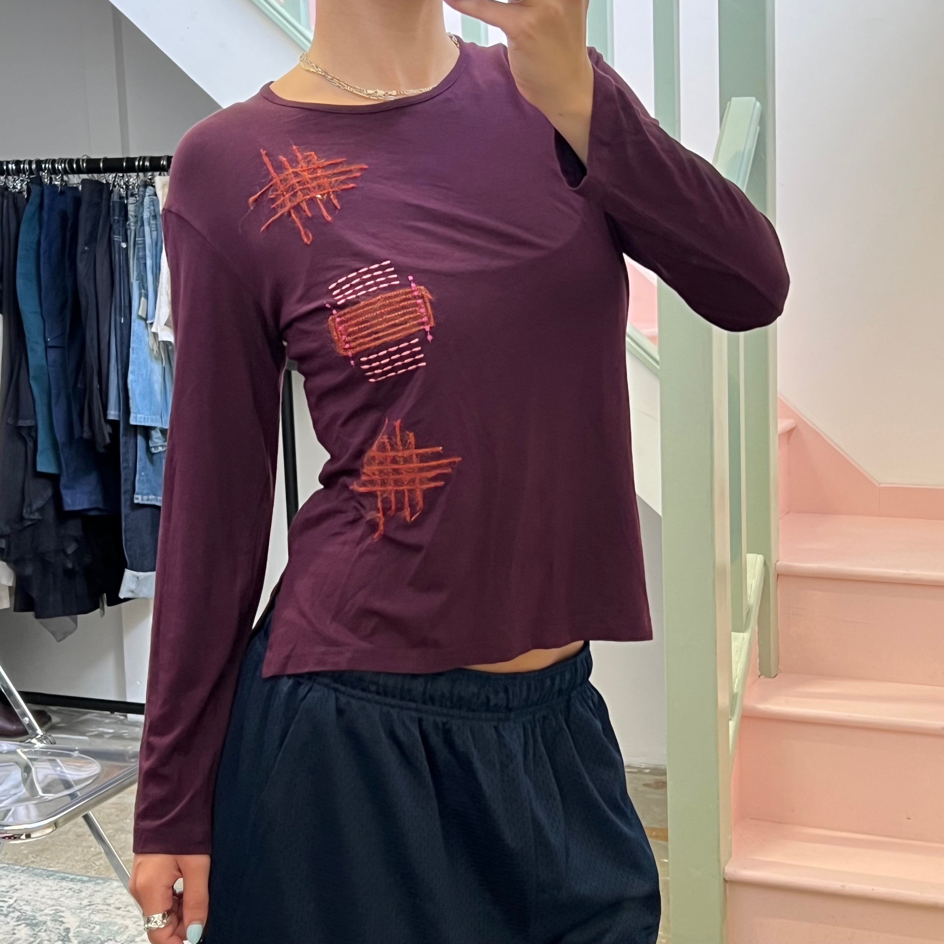 Propel mad orange contrast stitch top,