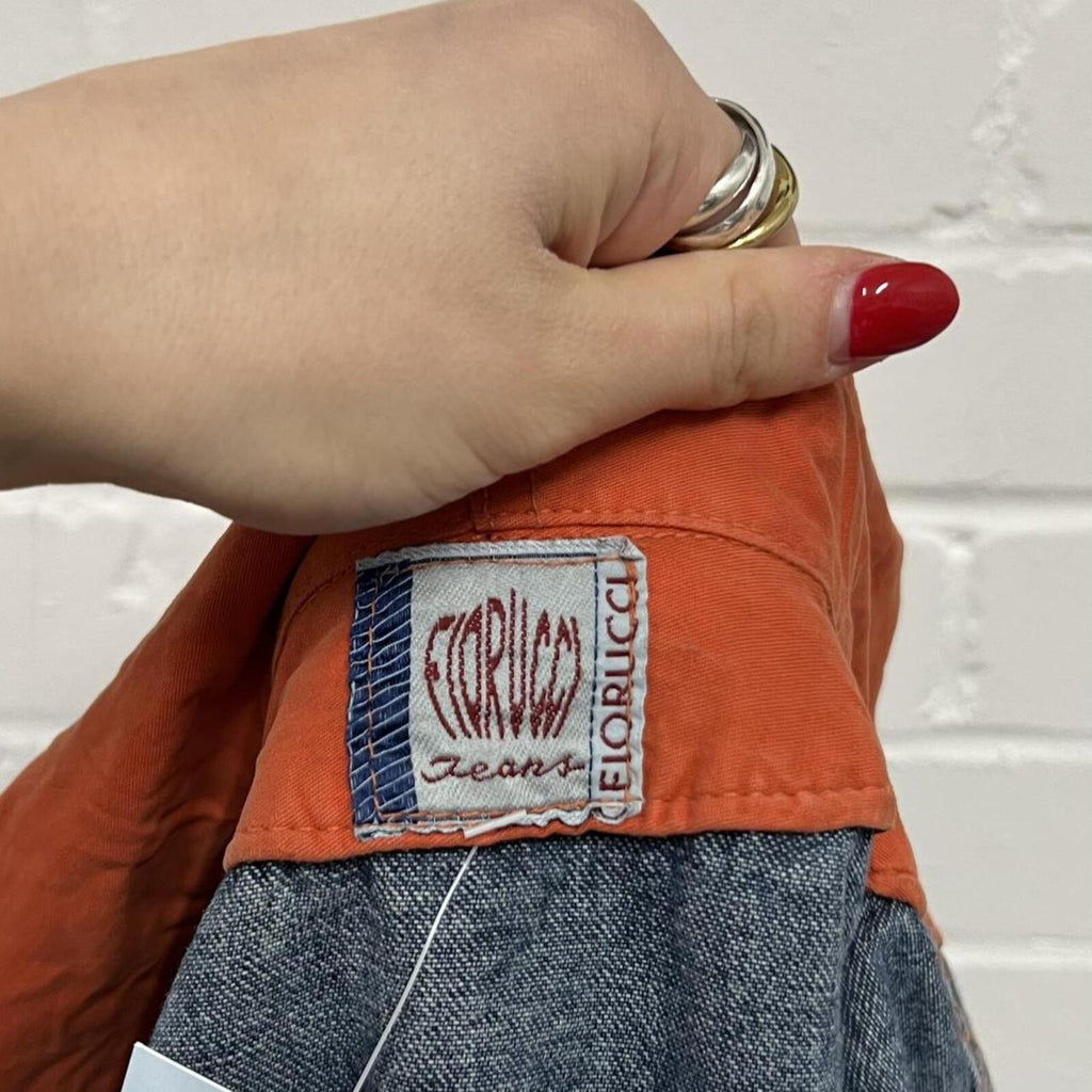 Fiorucci layered vintage denim jacket with orange hoodie layer
