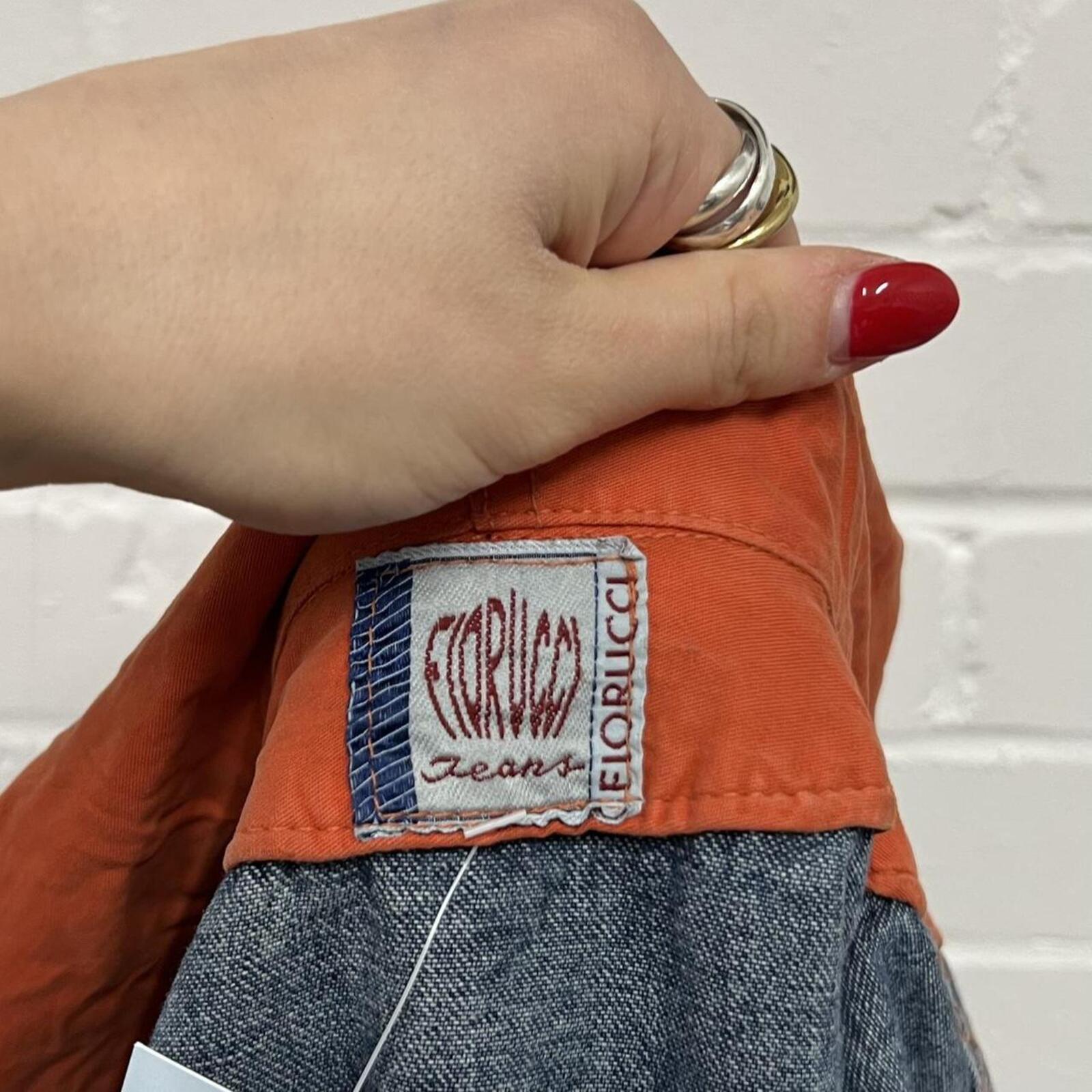 Fiorucci layered vintage denim jacket with orange hoodie layer
