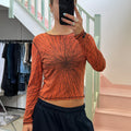 Orange and brown graphic print room