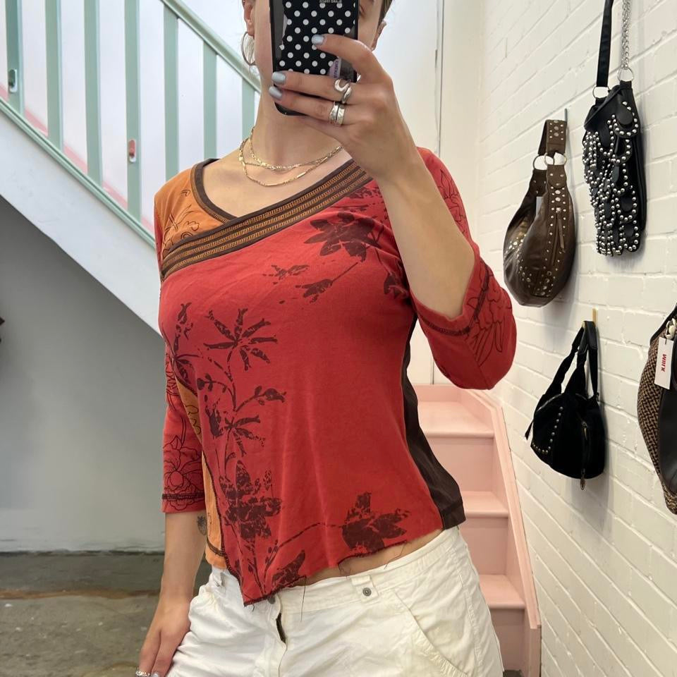 Orange and red graphic print top