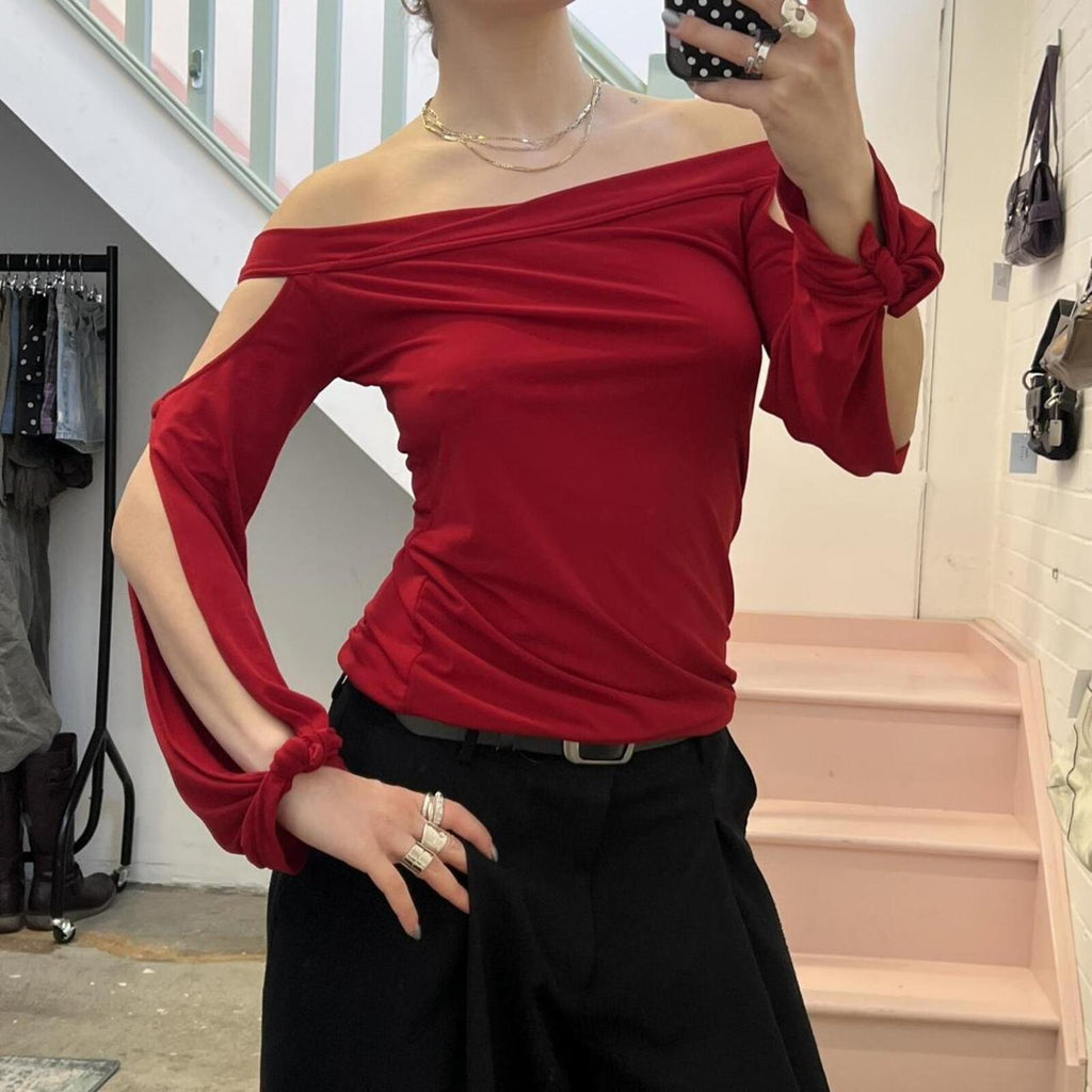 red slouchy off shoulder flared sleeve top with cutout detail