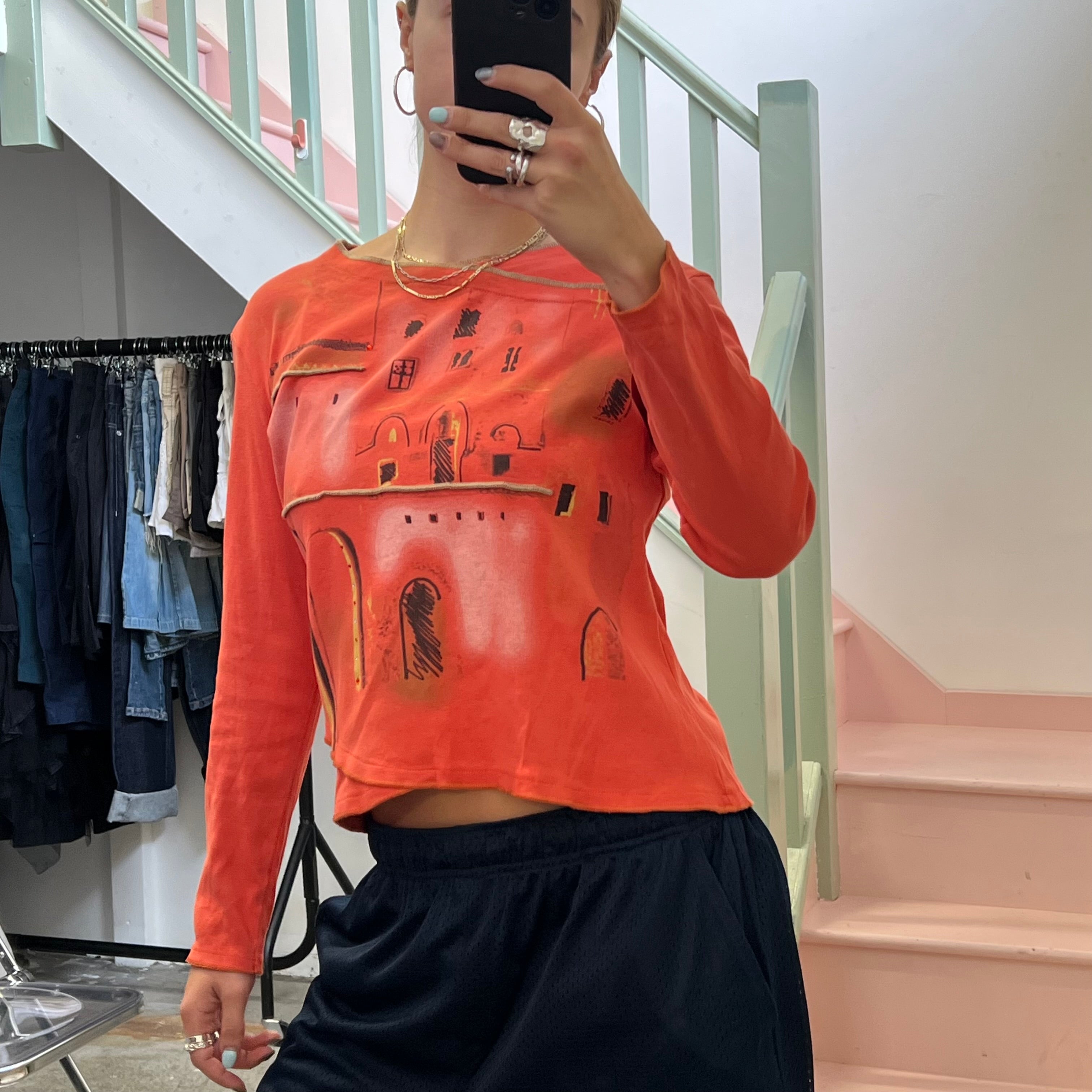 Orange graphic print top
