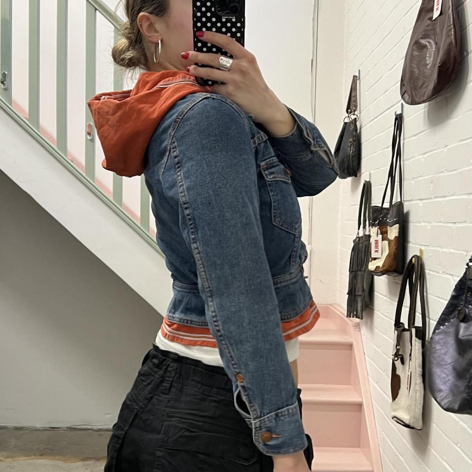 Fiorucci layered vintage denim jacket with orange hoodie layer