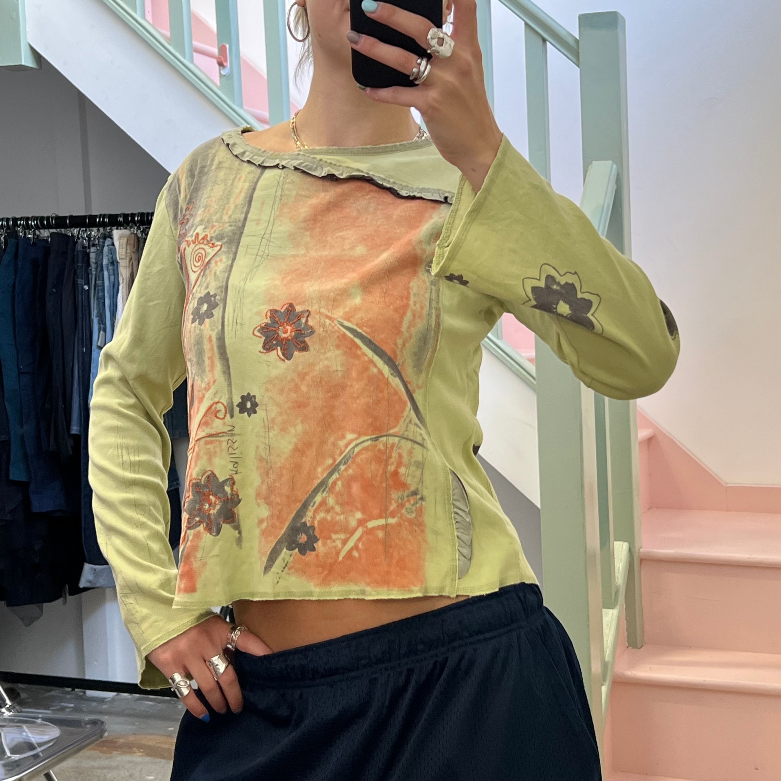 Green and brown blurred floral top