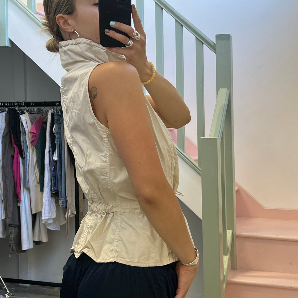 Cream sleeveless utility style vest