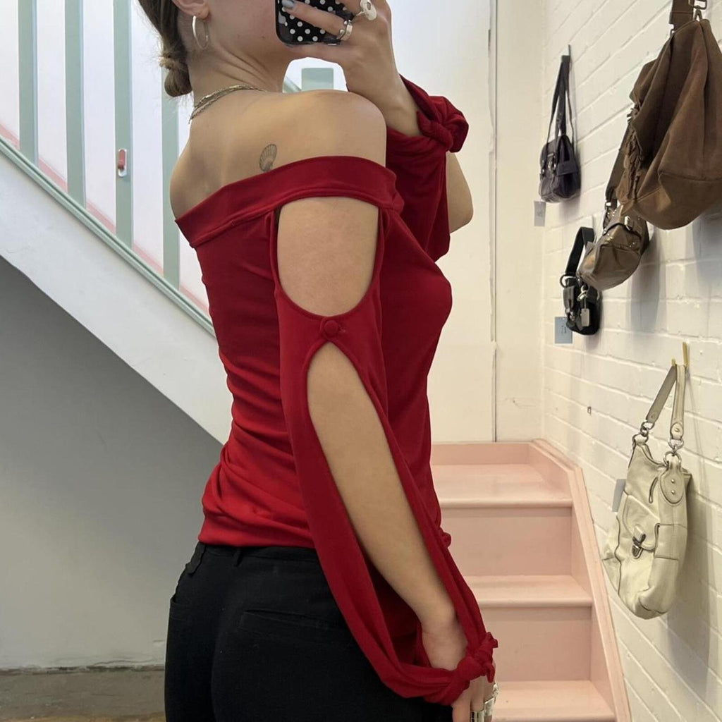 red slouchy off shoulder flared sleeve top with cutout detail
