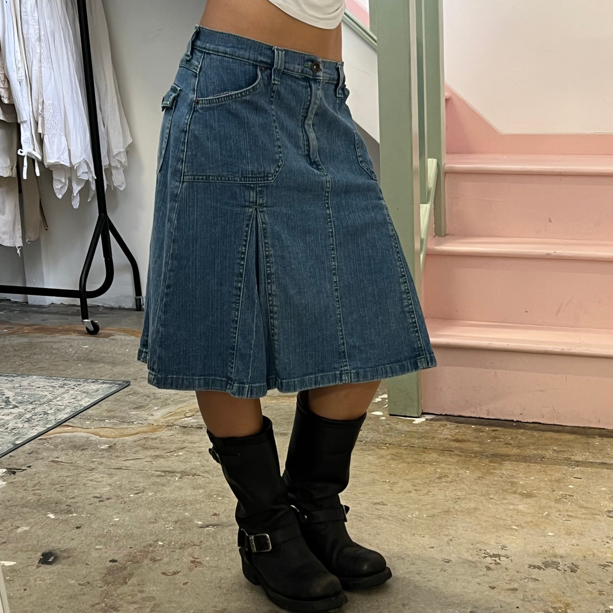 Denim pleated midi skirt with green stitching