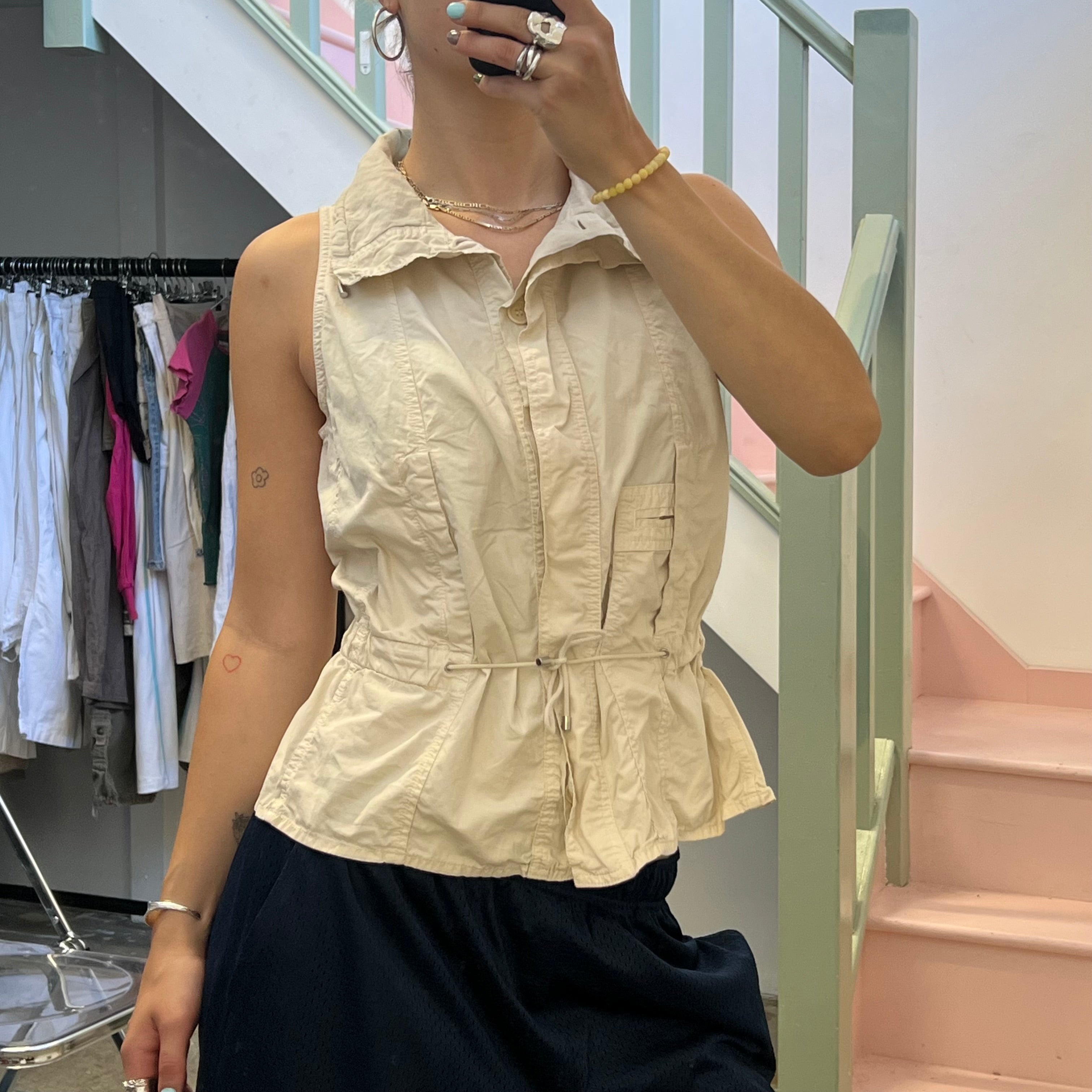 Cream sleeveless utility style vest