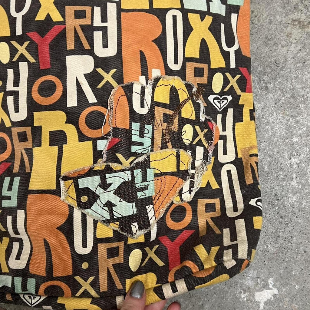 brown and orange Roxy graphic print shoulder bag