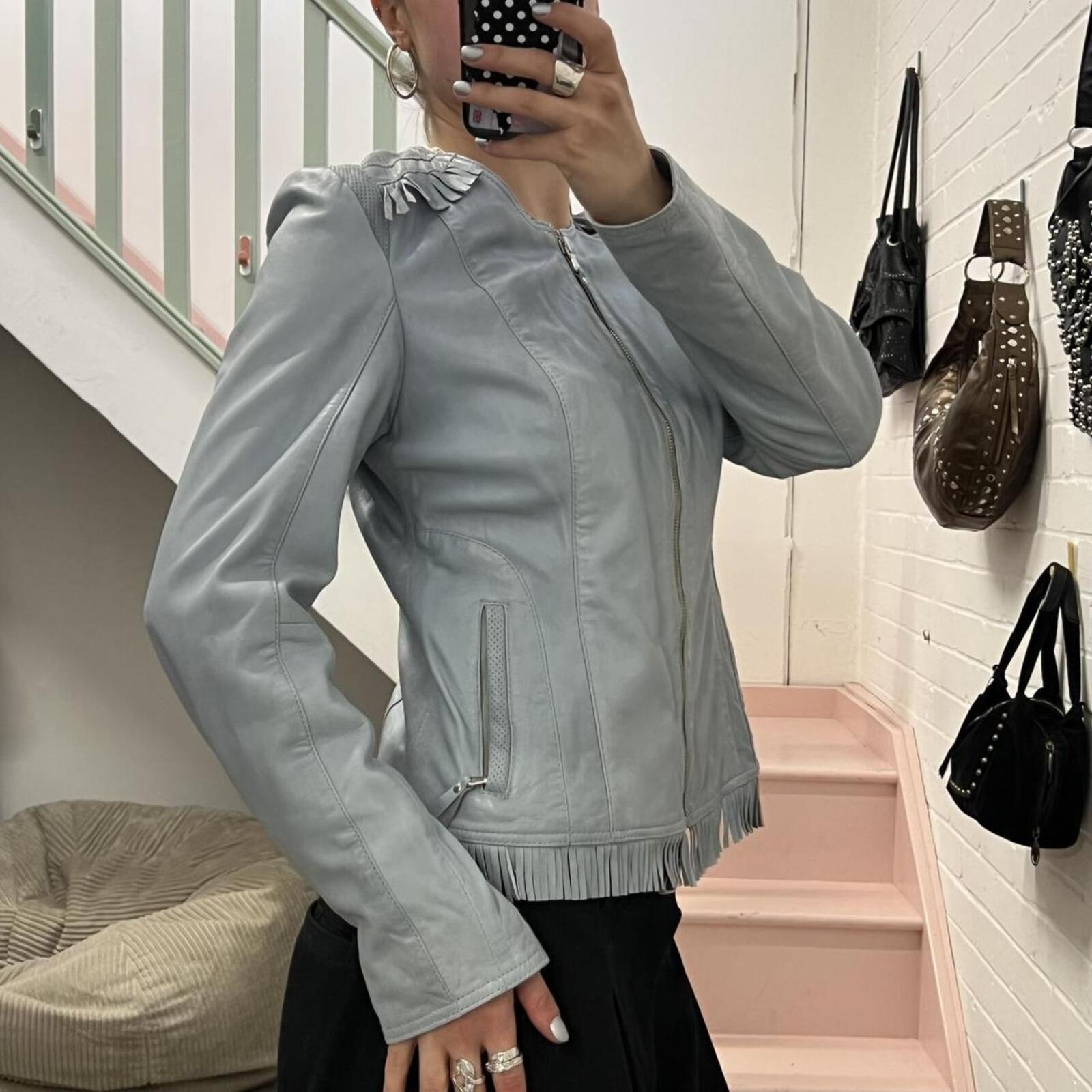 Baby blue fitted zip up leather jacket with fringing