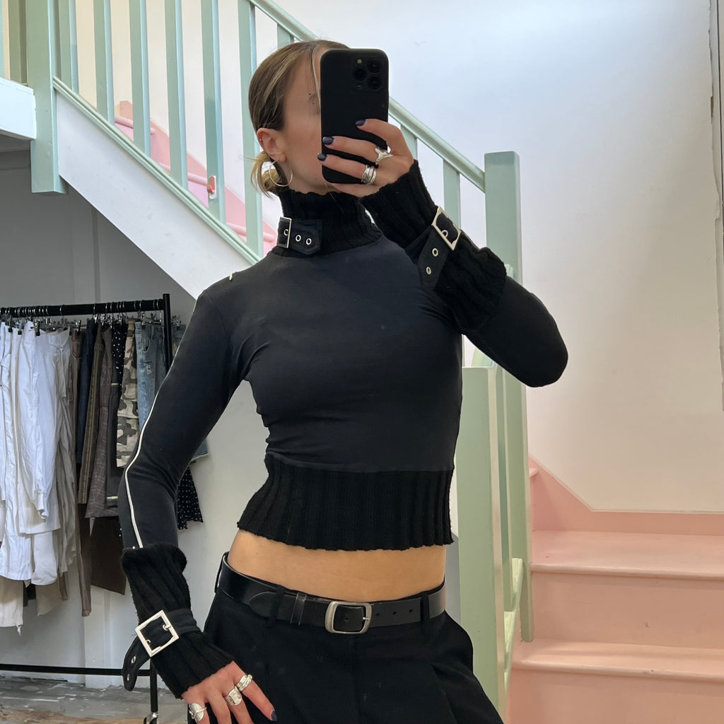 Black roll neck top with zips and buckles