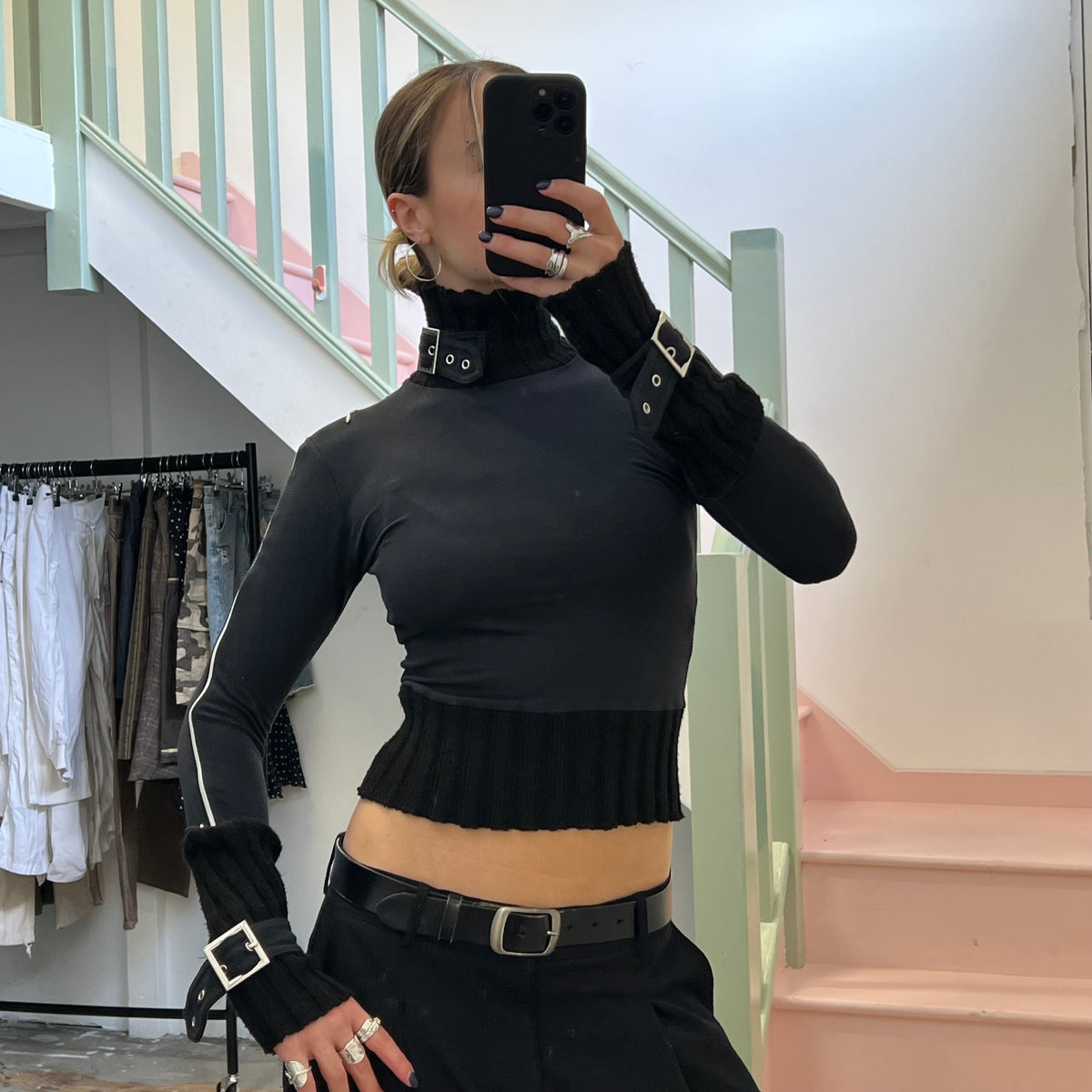 Black roll neck top with zips and buckles