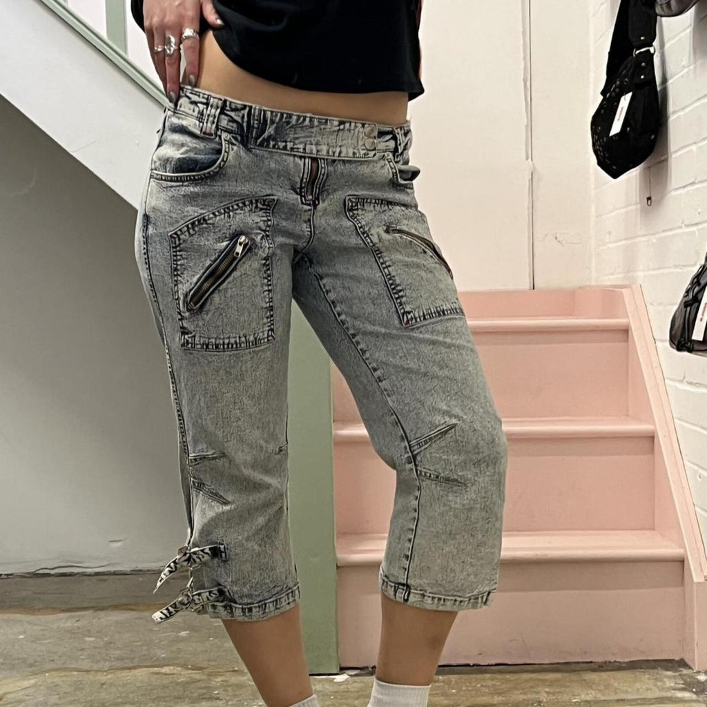 acid wash low rise denim capris with zips and buckles
