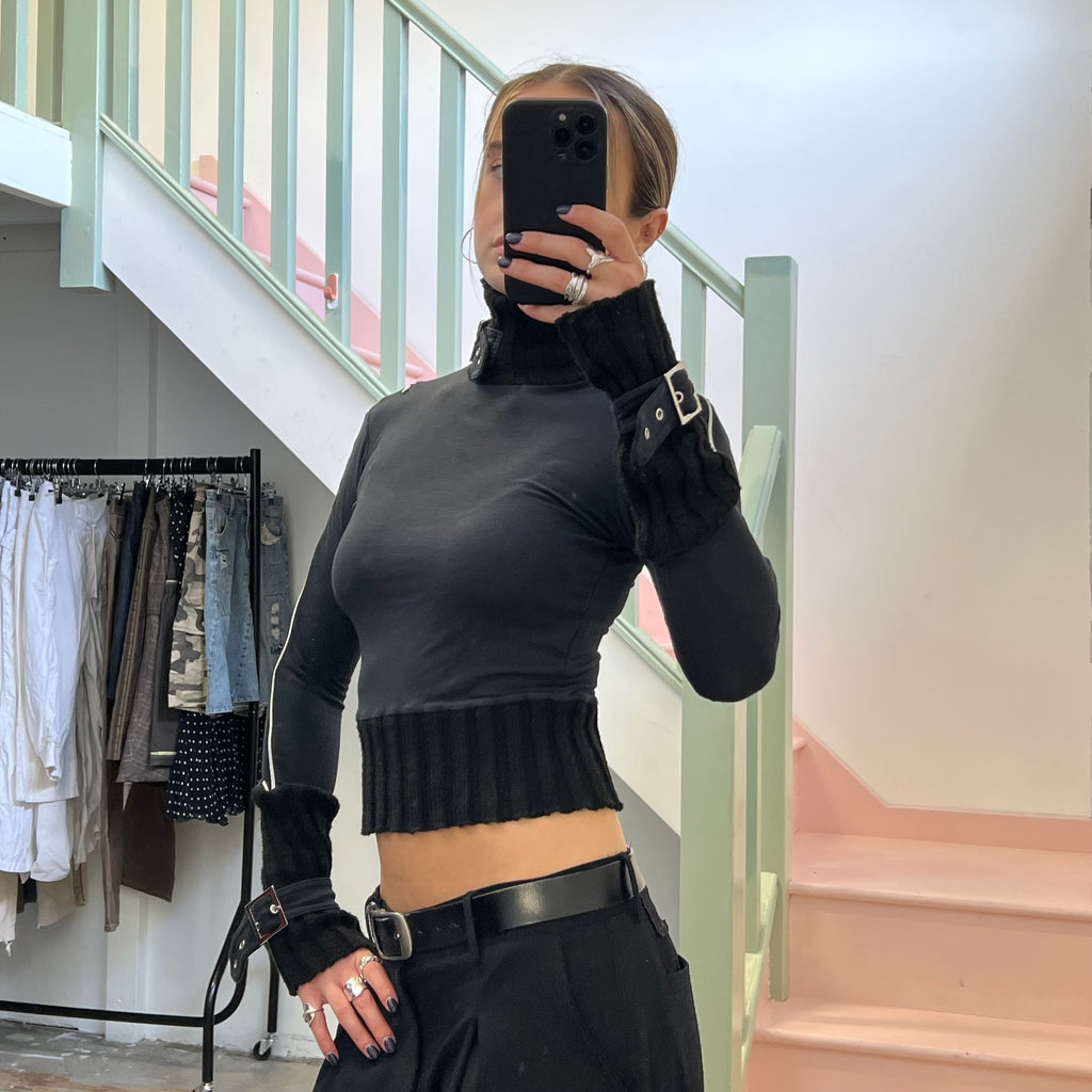 Black roll neck top with zips and buckles
