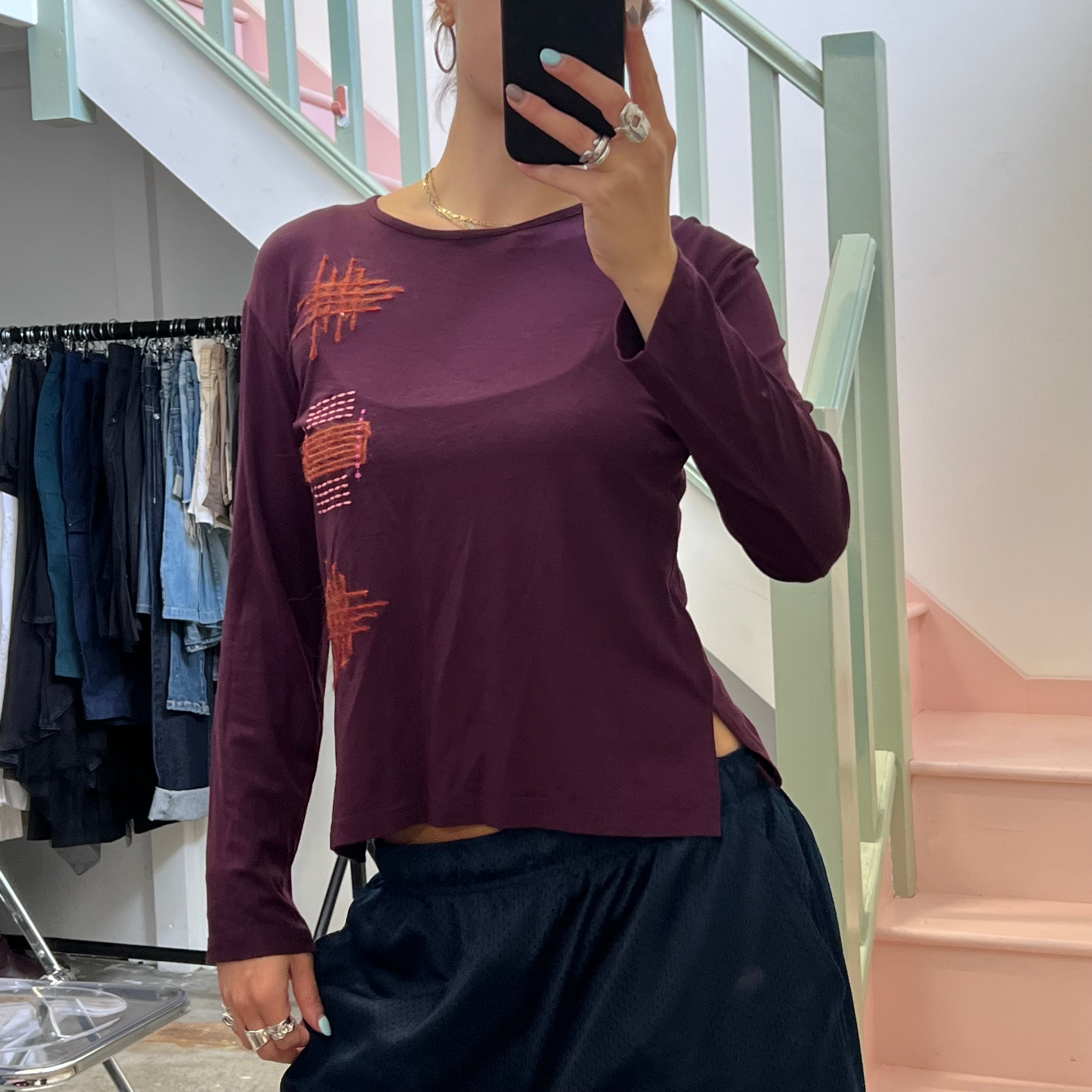 Propel mad orange contrast stitch top,