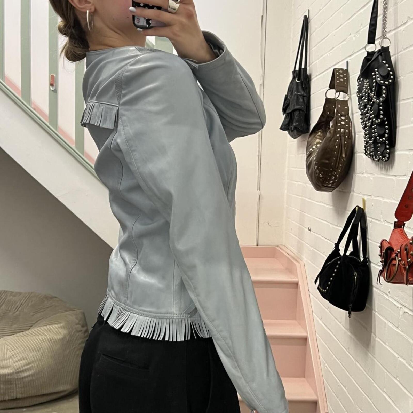 Baby blue fitted zip up leather jacket with fringing
