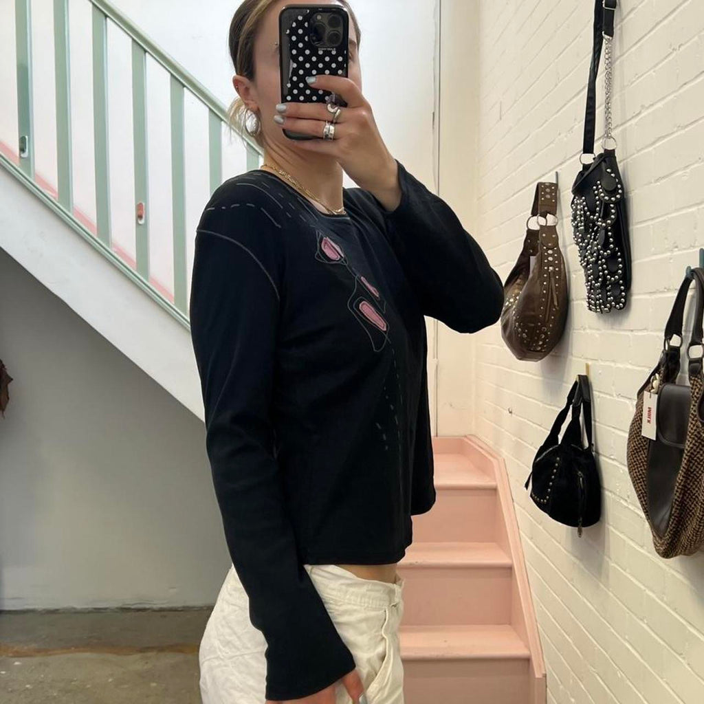 Black and pink graphic long sleeve top