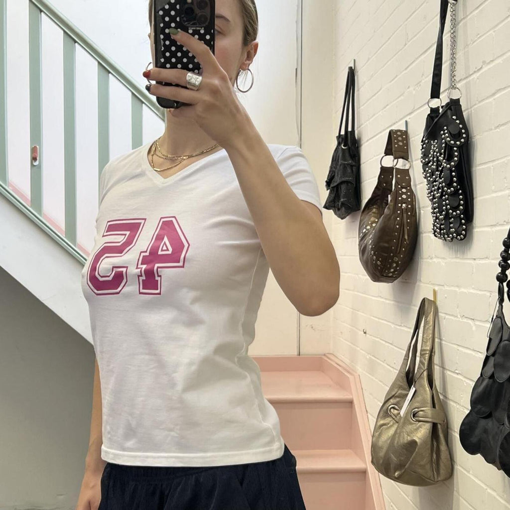 White fitted v neck baby tee with pink number print