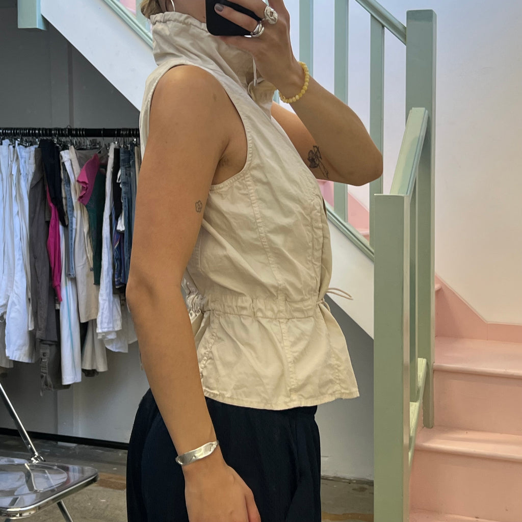Cream sleeveless utility style vest