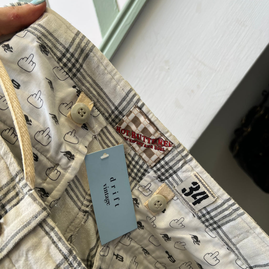 White and grey checkered baggy cargo shorts