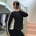Black and cream knitted zip sweater