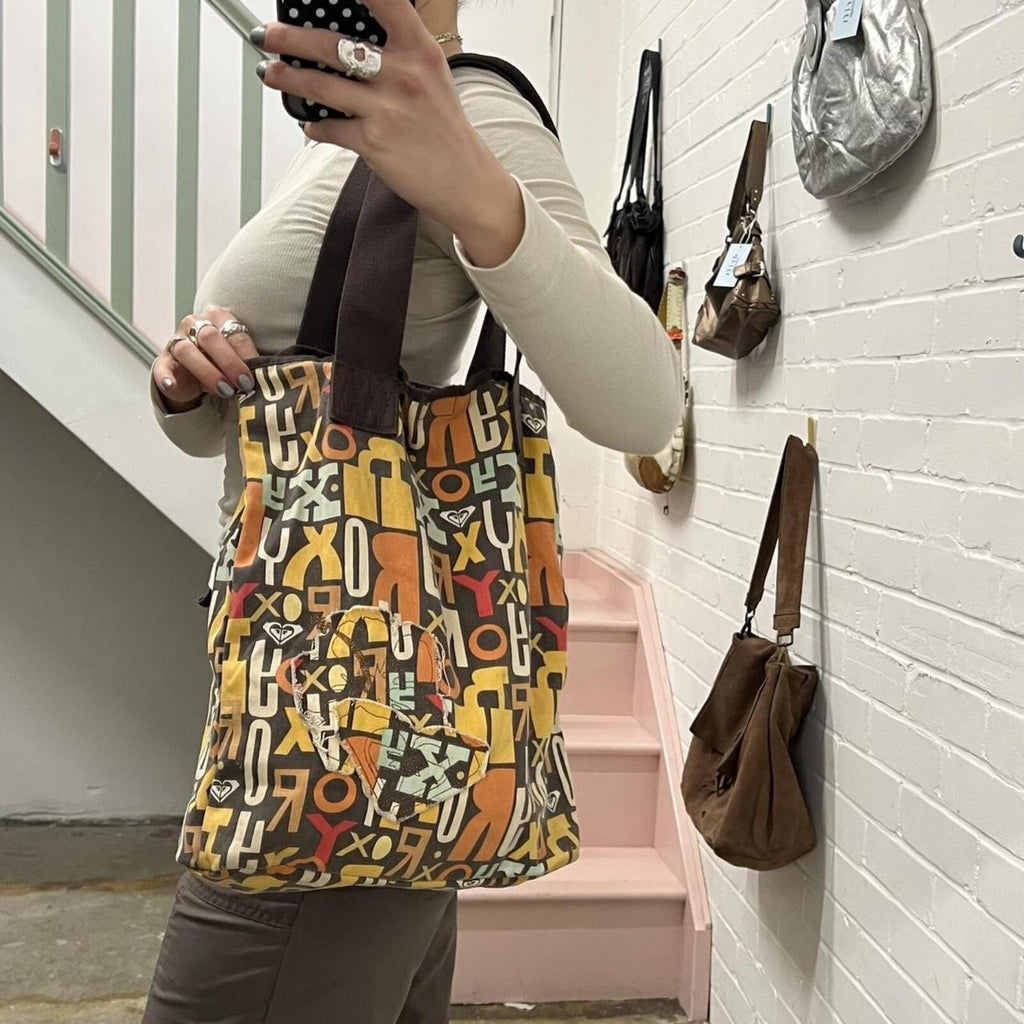 brown and orange Roxy graphic print shoulder bag