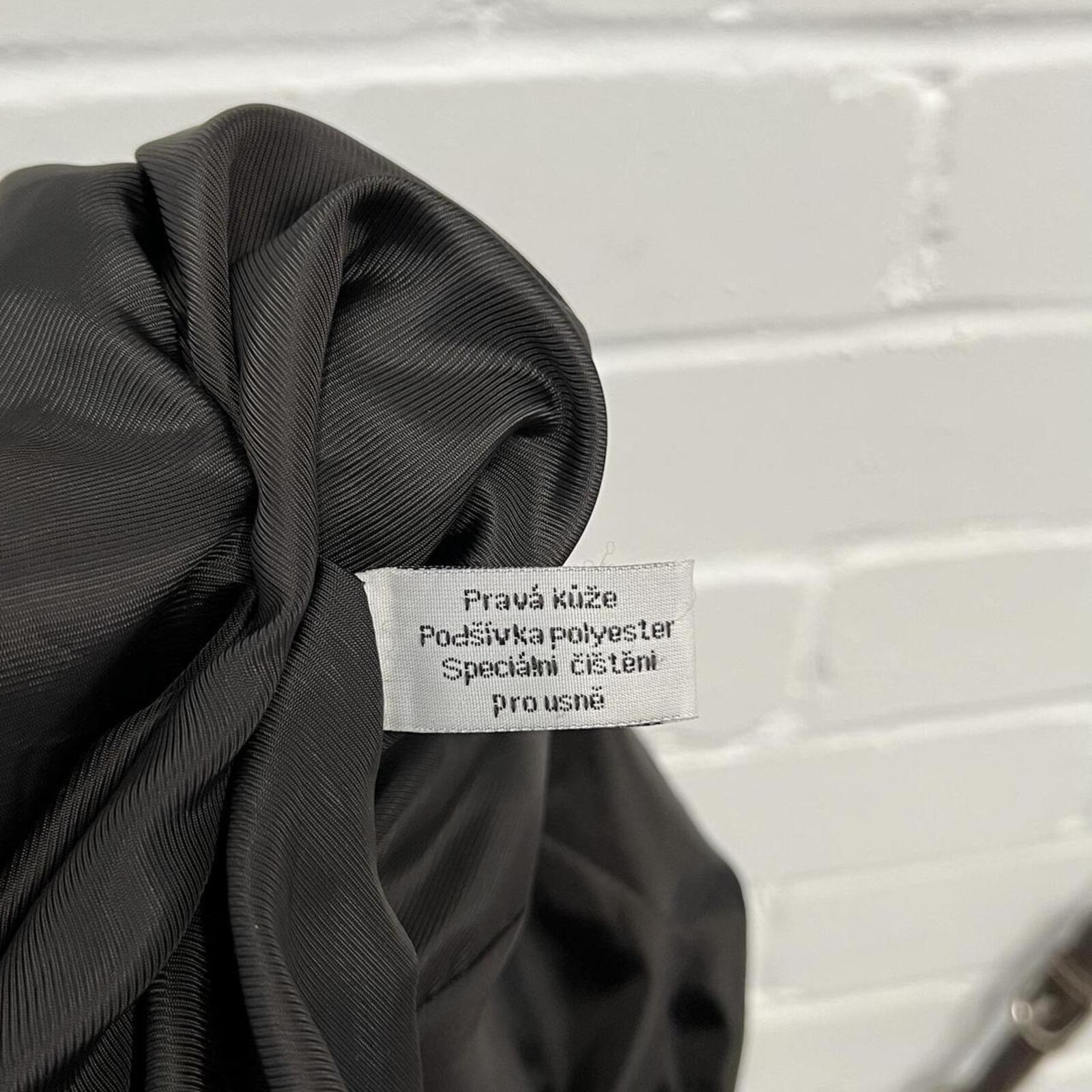 dark brown black vintage leather bomber jacket with silver buckles, oversized button and detachable fur trim hood