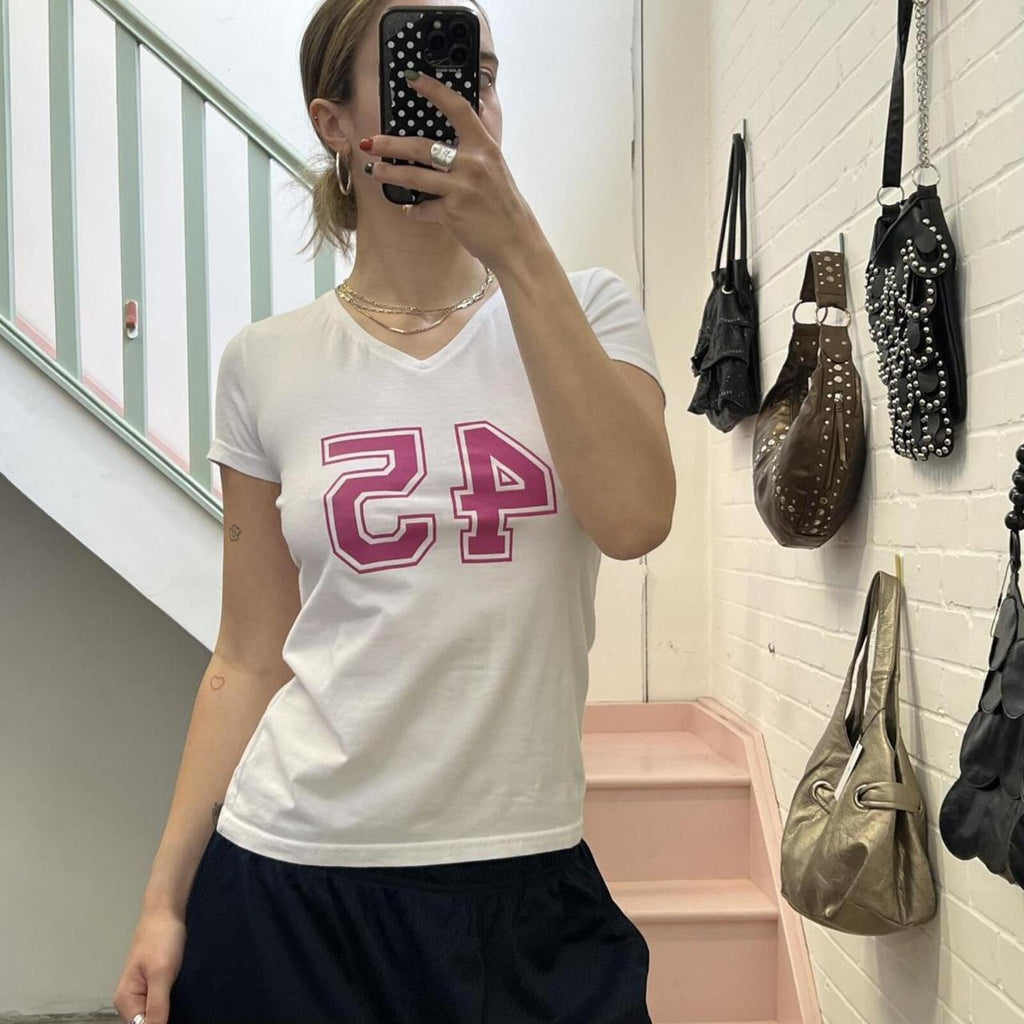 White fitted v neck baby tee with pink number print