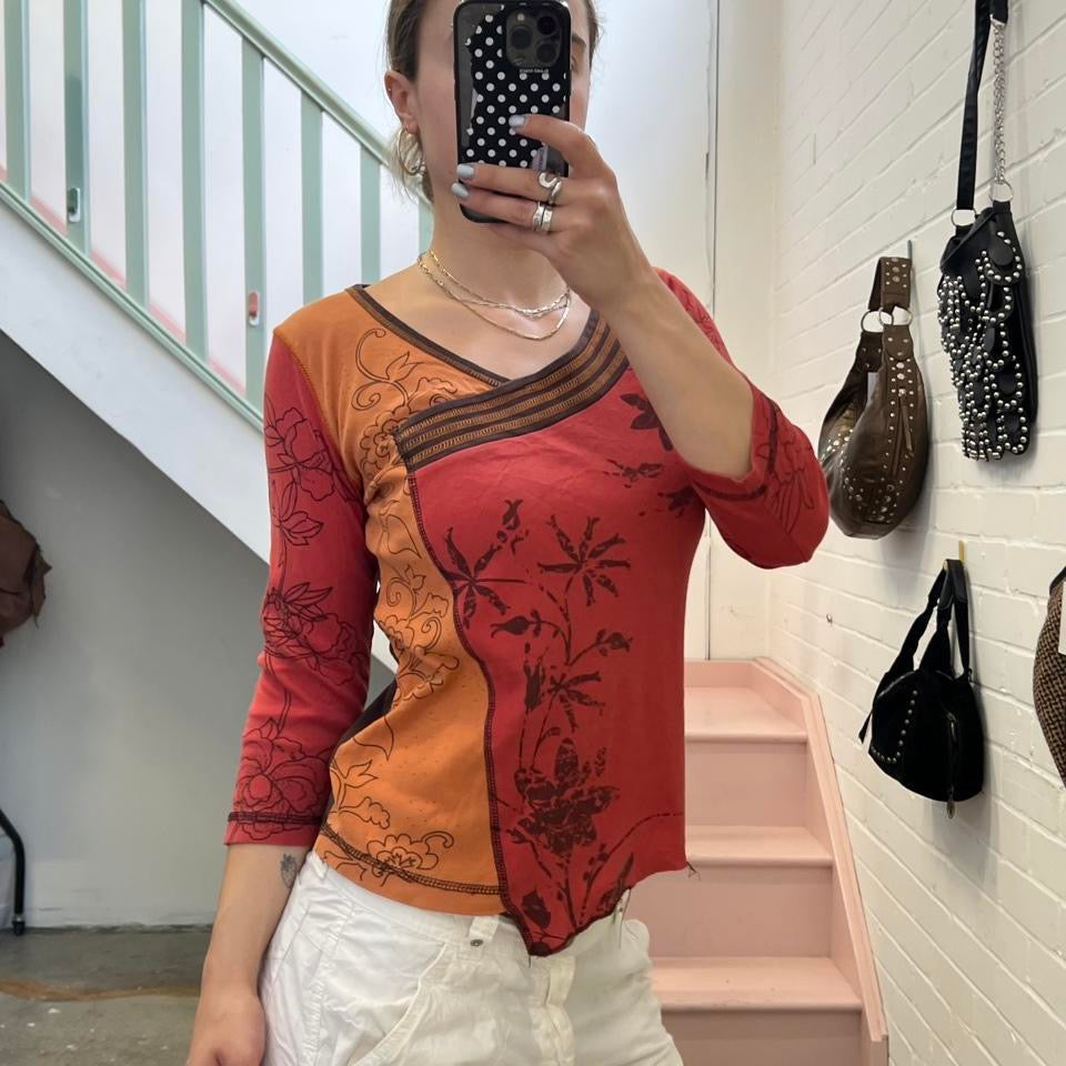 Orange and red graphic print top