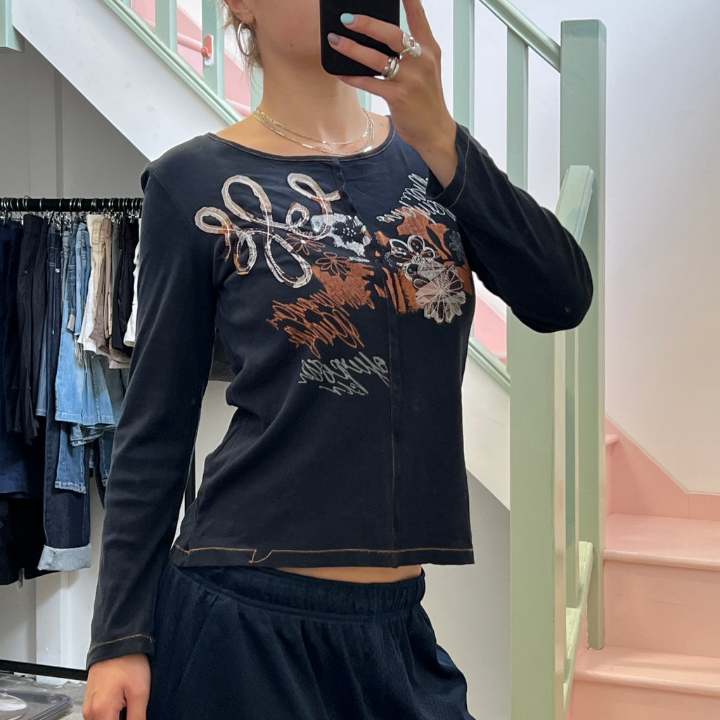 Black and orange graphic print top