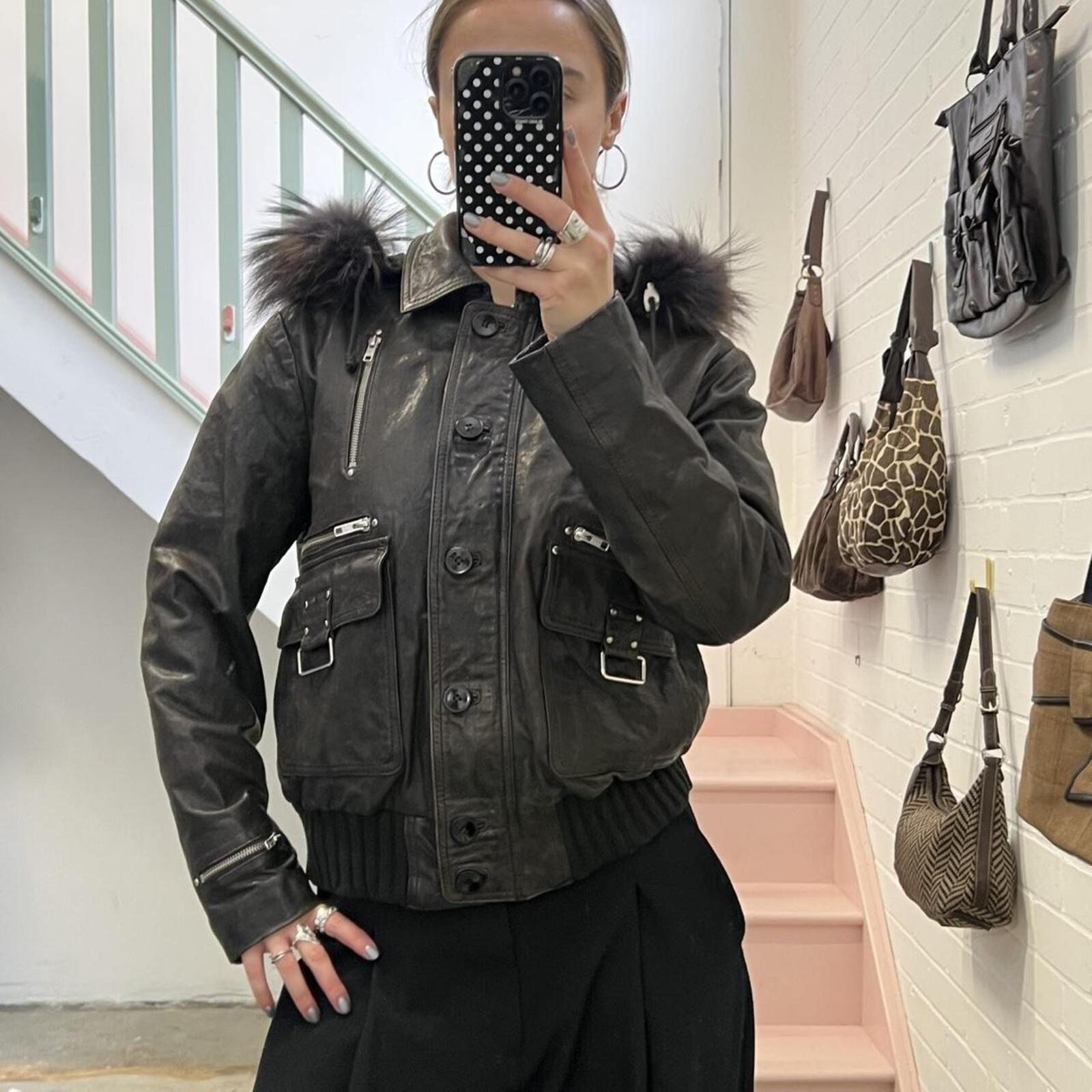 dark brown black vintage leather bomber jacket with silver buckles, oversized button and detachable fur trim hood