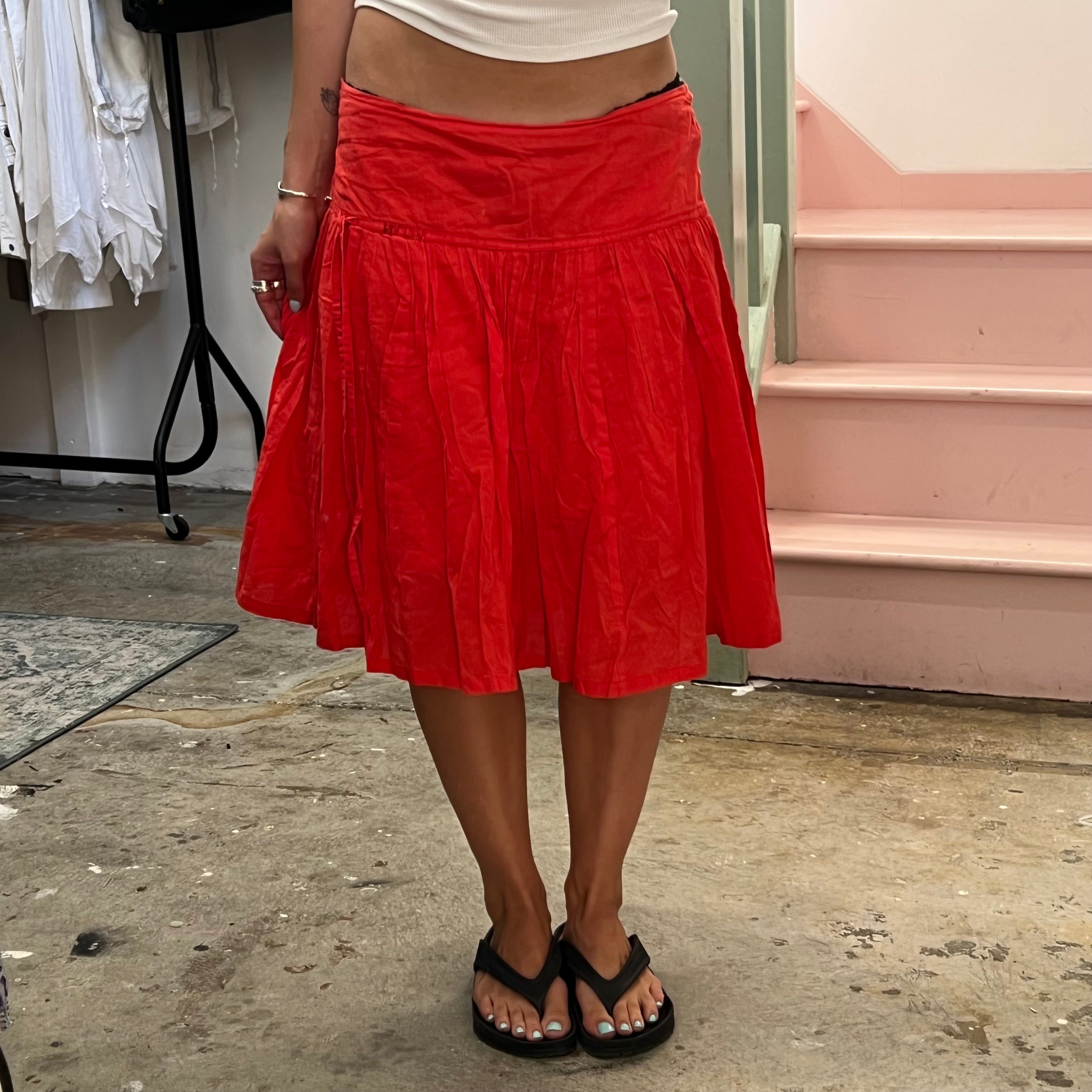 Red low rise pleated floaty midi skirt