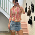 Distressed light wash denim mini skirt