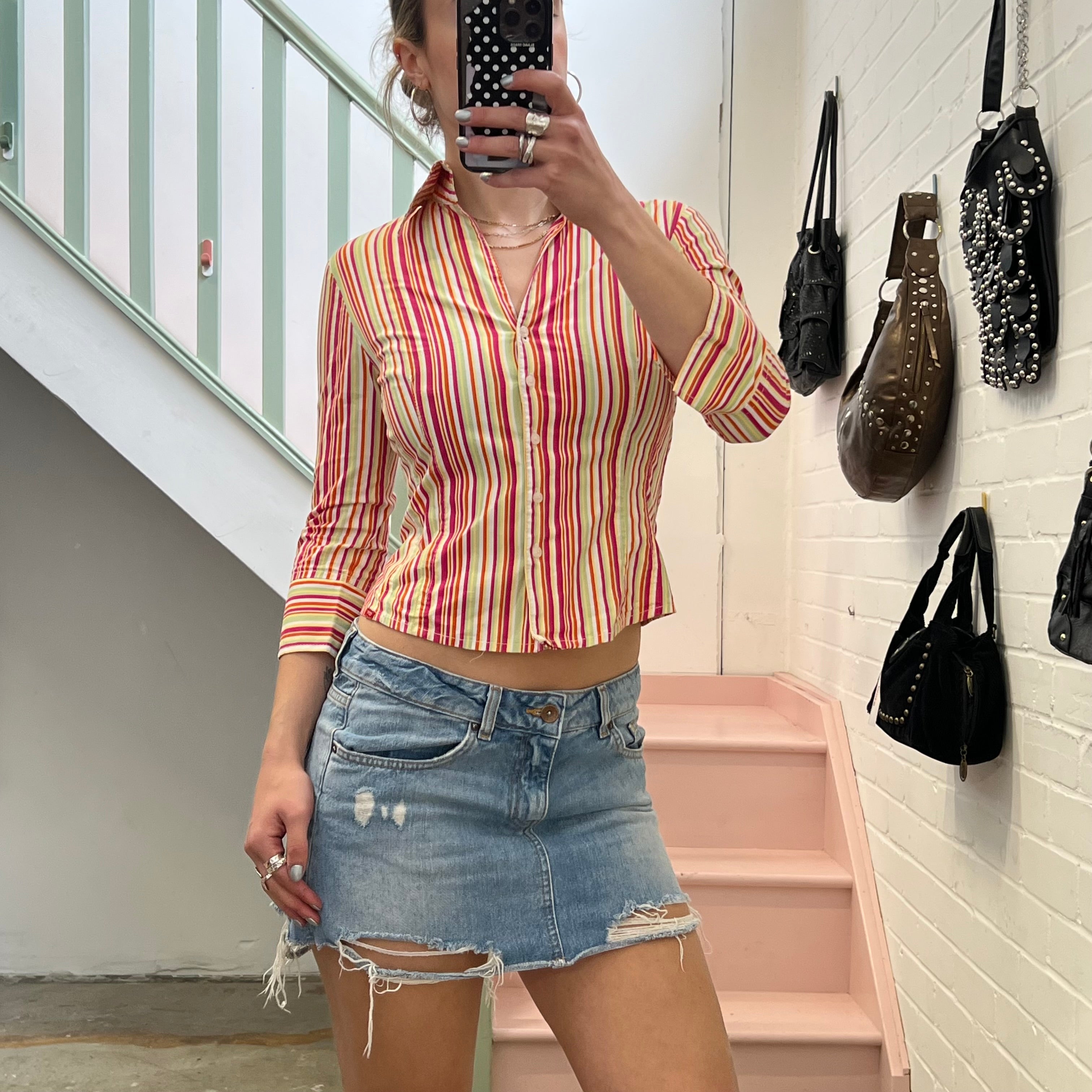 Distressed light wash denim mini skirt