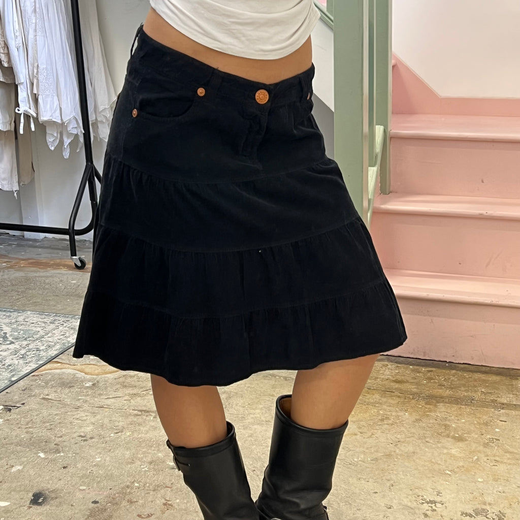 Black tiered corduroy midi skirt
