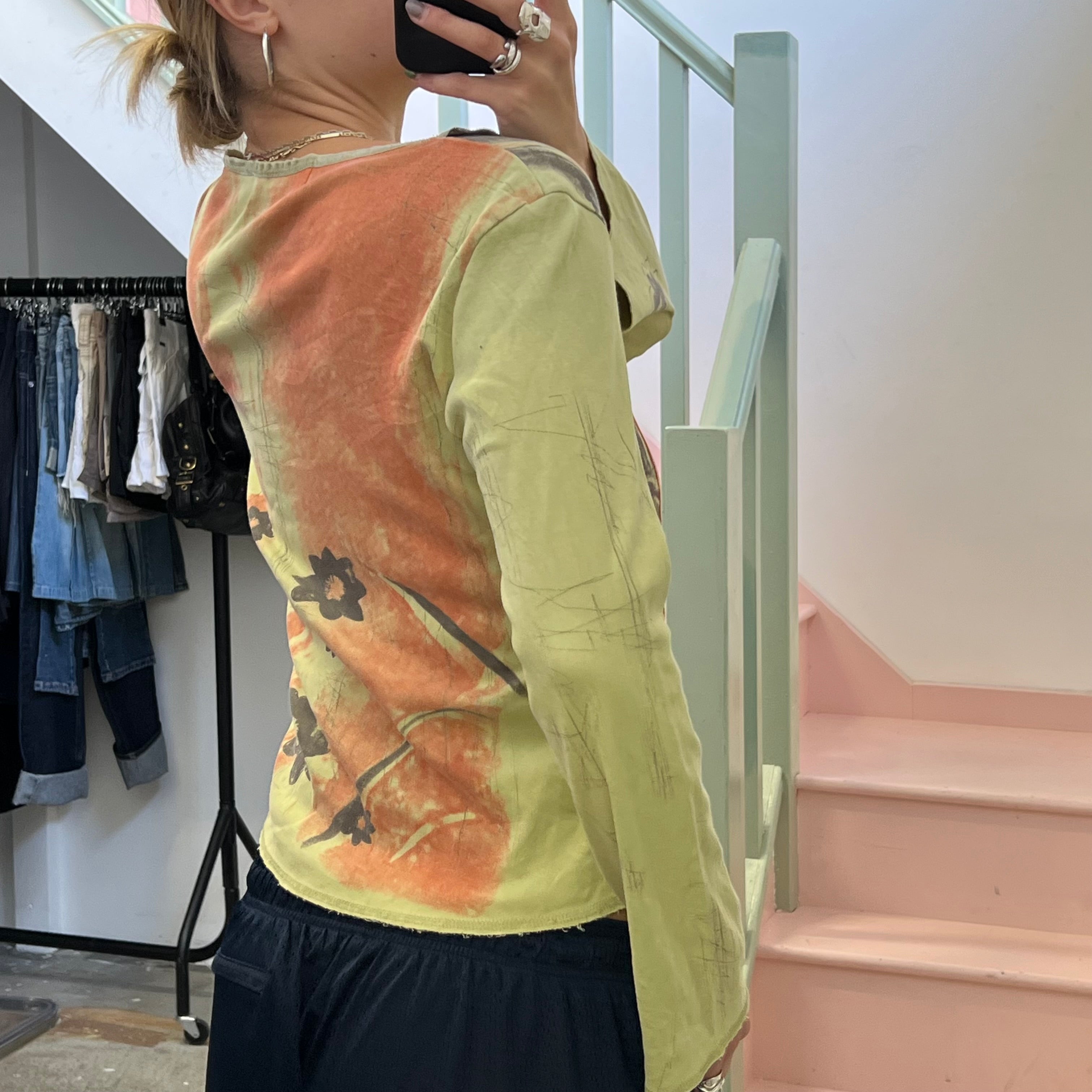 Green and brown blurred floral top