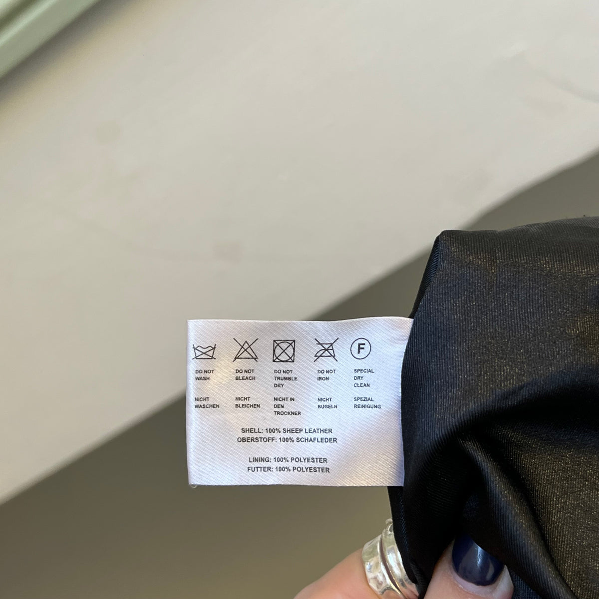 Black leather button up utility jacket
