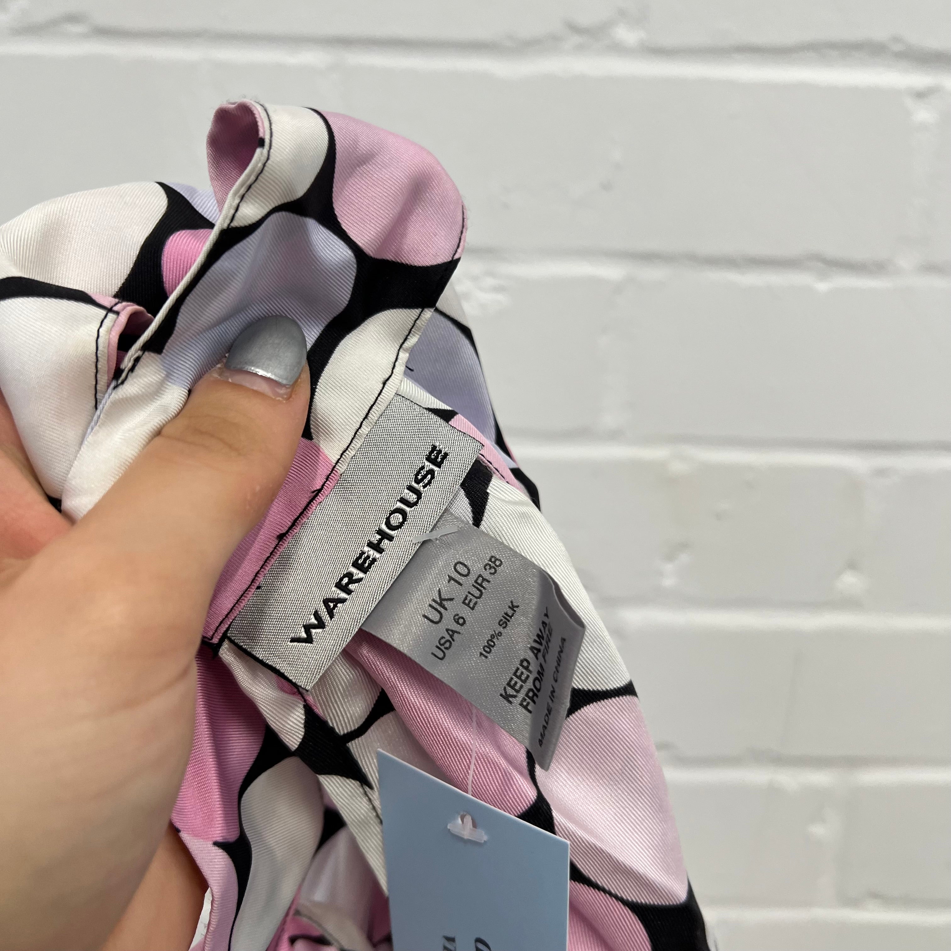 Pastel pink polka dot high neck vest