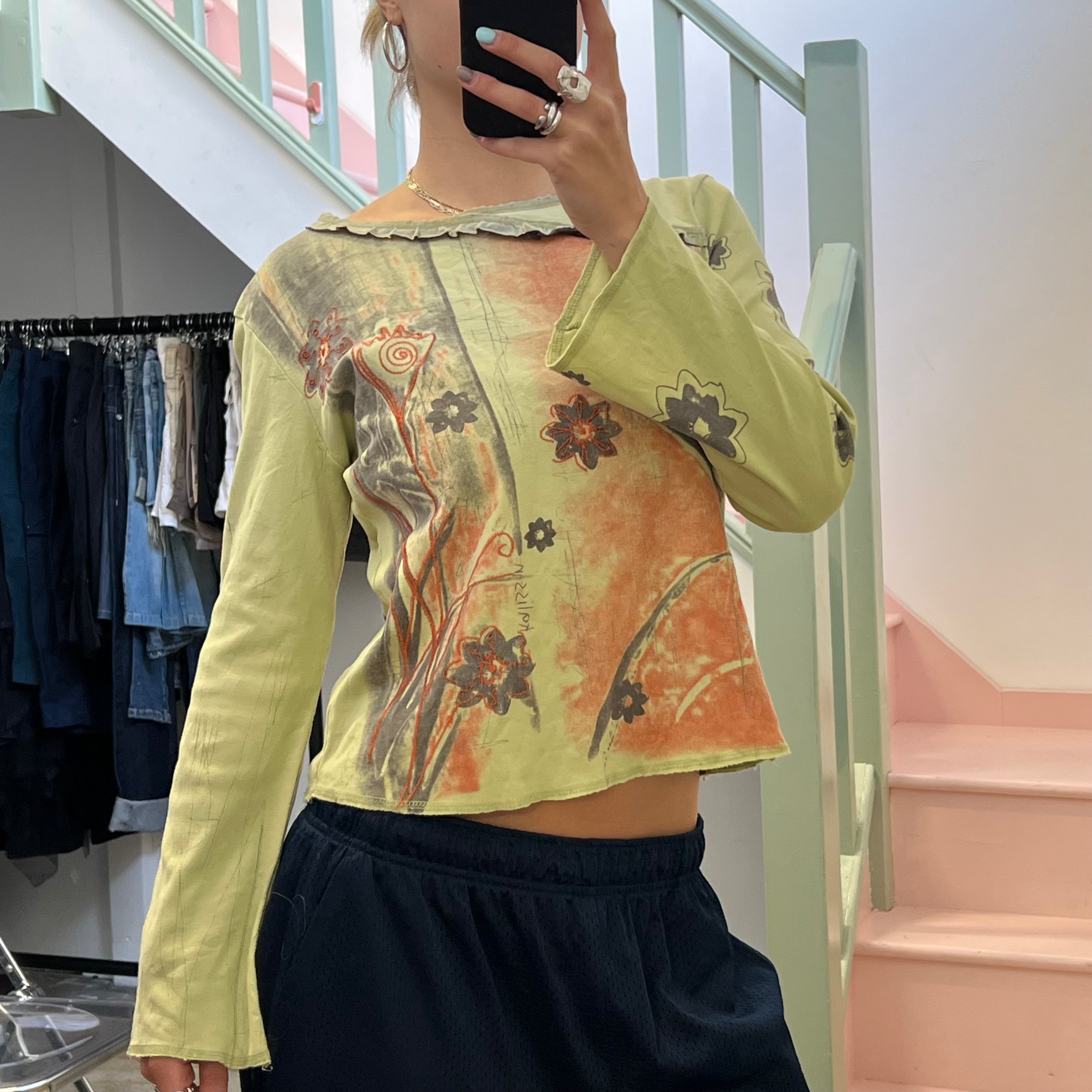 Green and brown blurred floral top