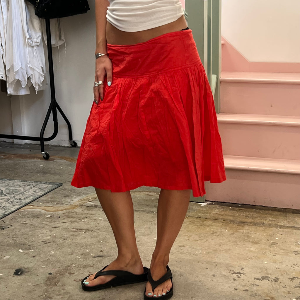 Red low rise pleated floaty midi skirt