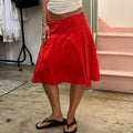 Red low rise pleated floaty midi skirt