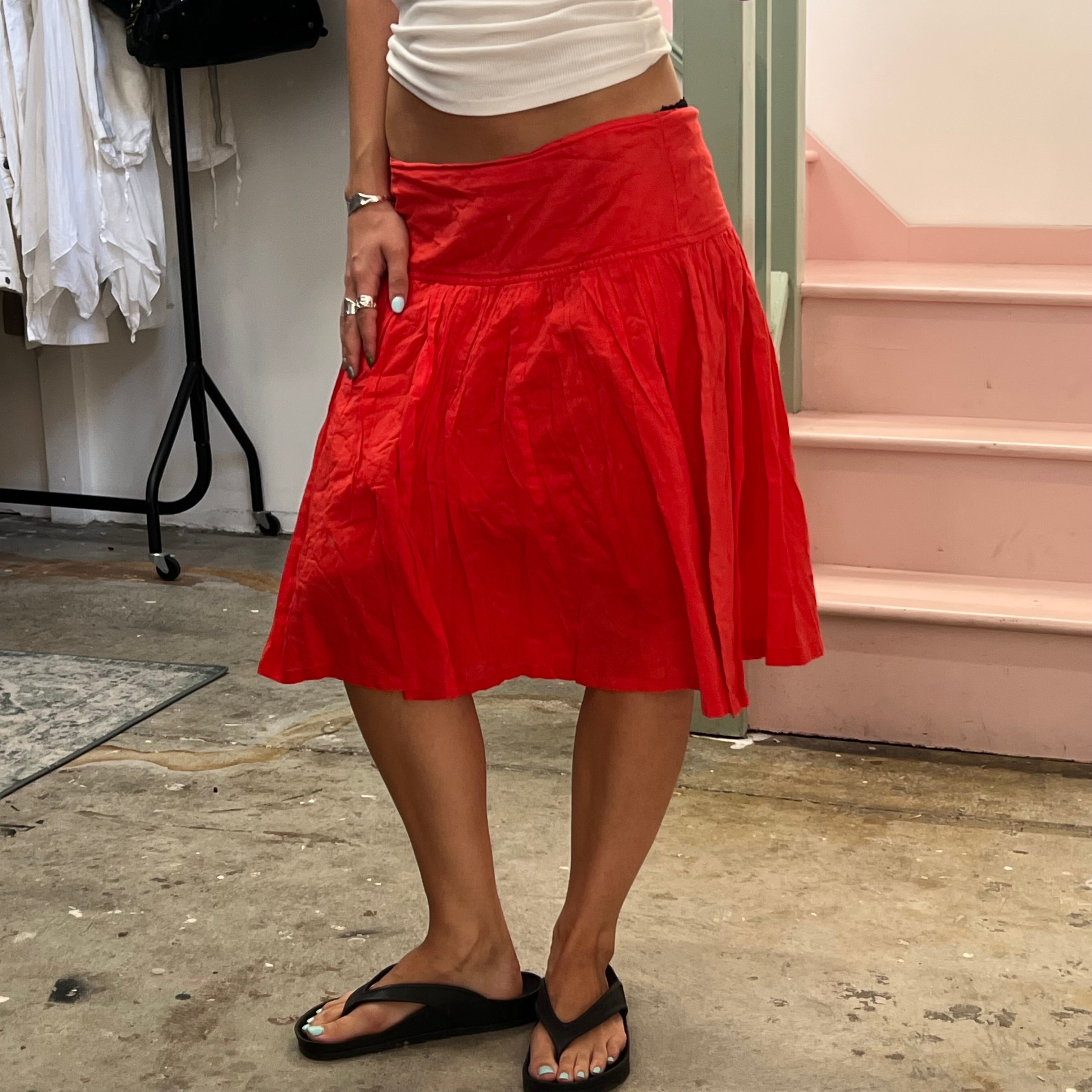 Red low rise pleated floaty midi skirt