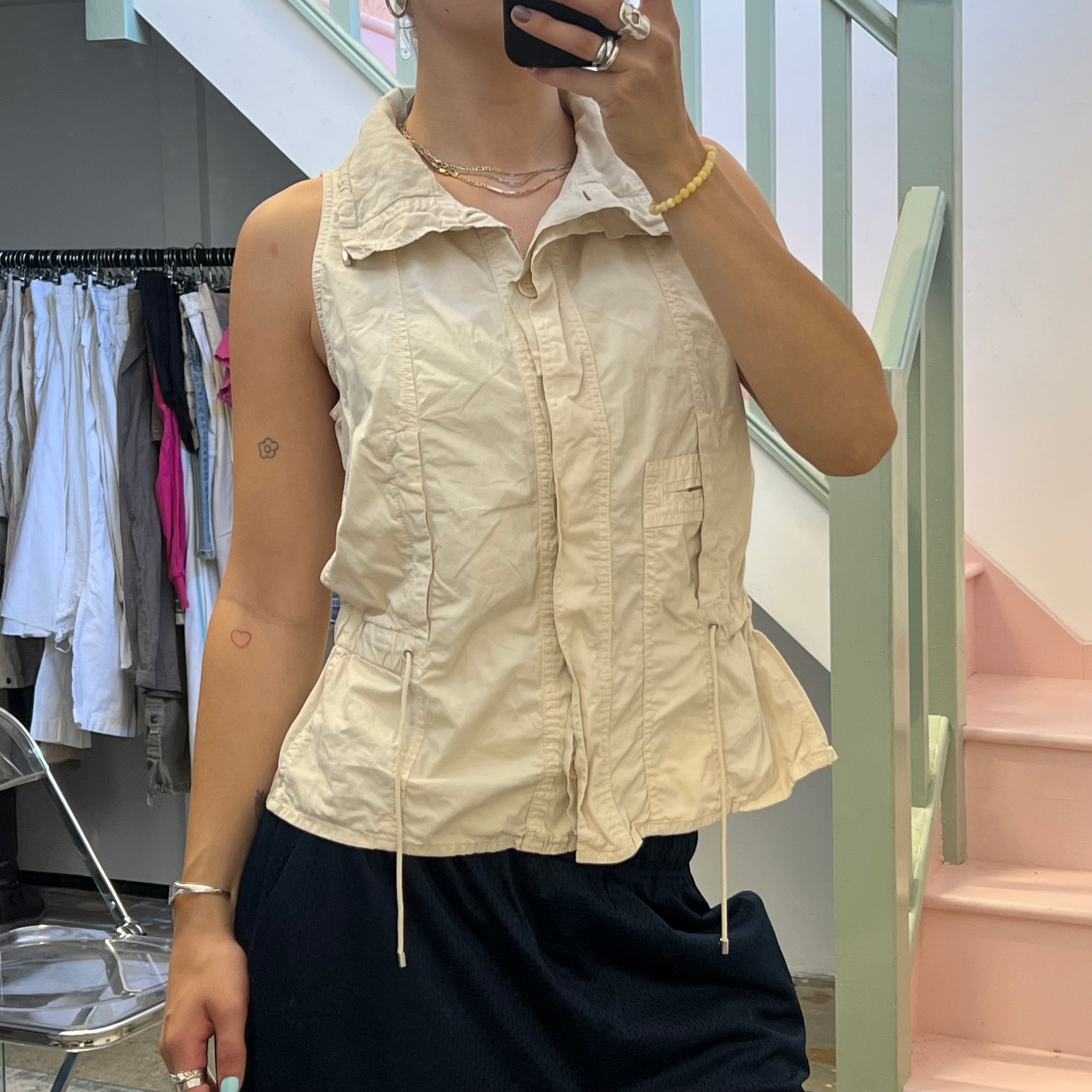 Cream sleeveless utility style vest