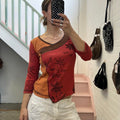 Orange and red graphic print top